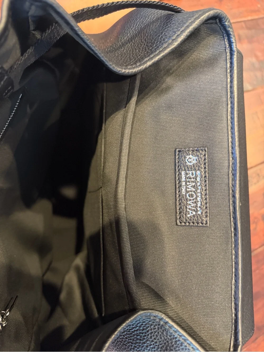 RIMOWA Black Leather Men's Backpack with Front Flap, used only once.